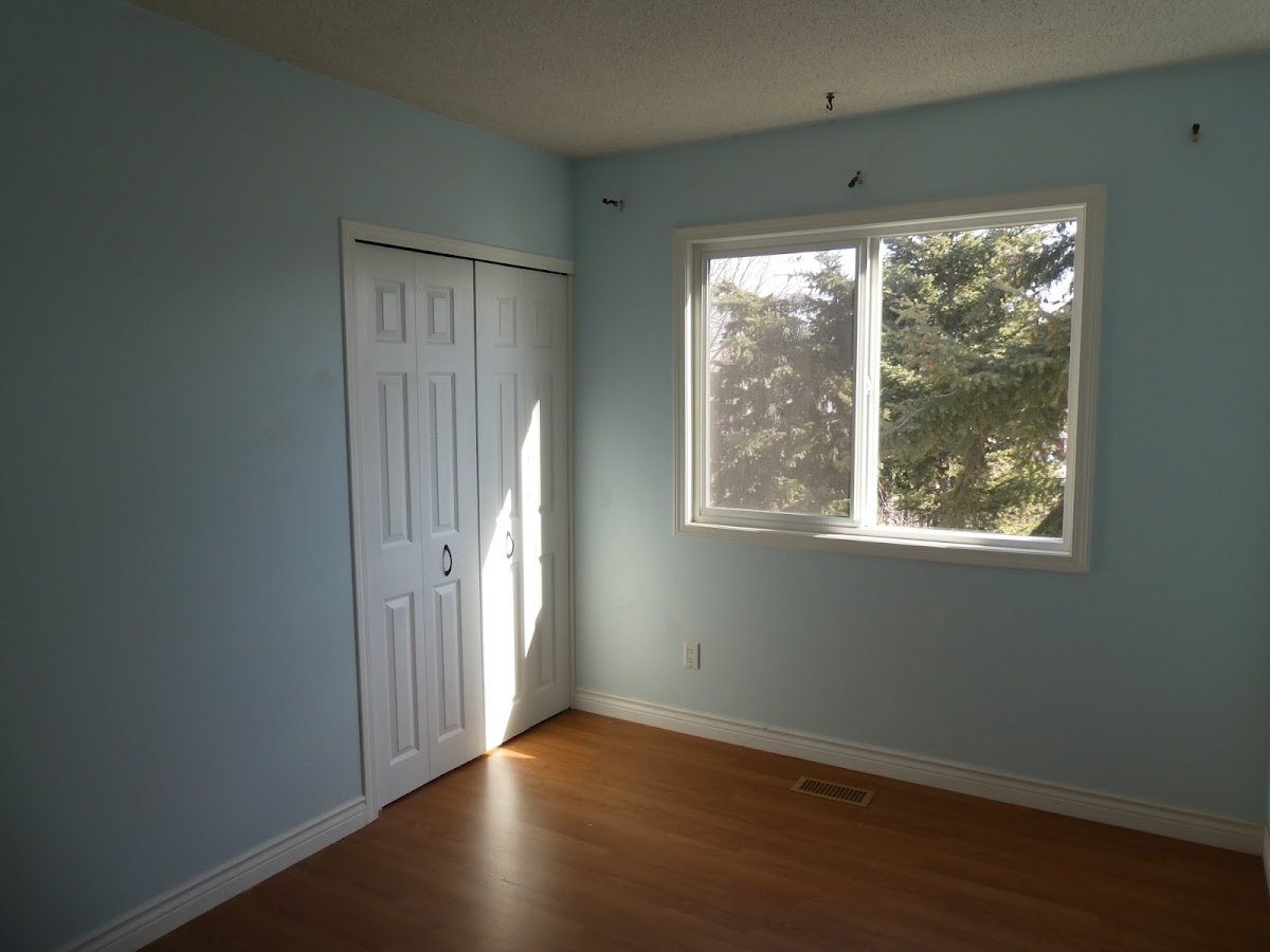 Pale blue room with crisp white closet doors